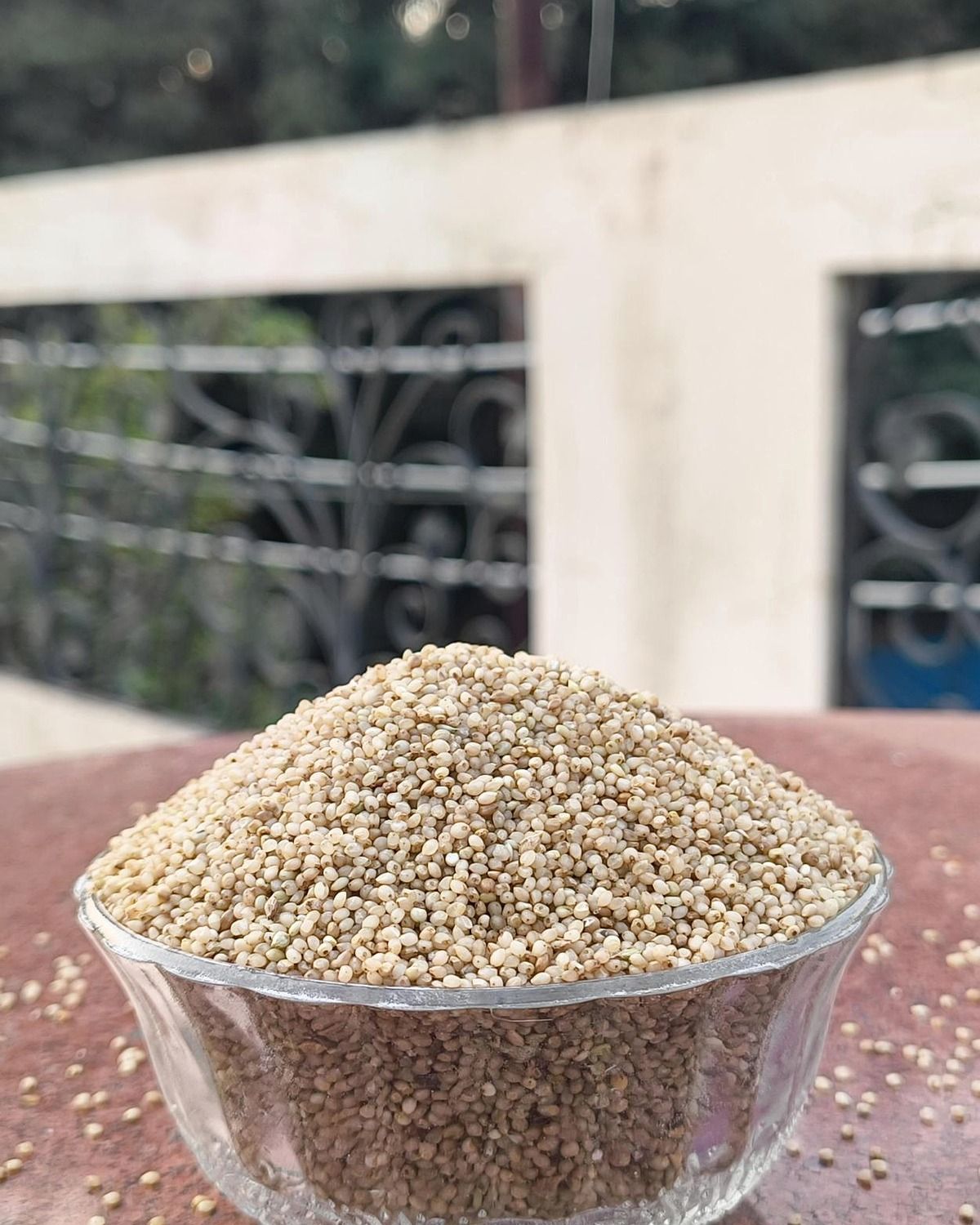 Real hands inspecting fine little millet samai grains