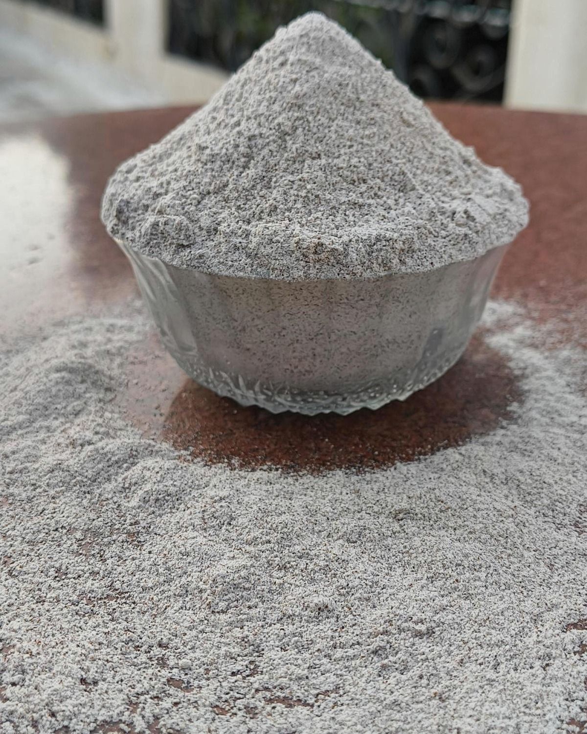 Ragi flour mounded in pristine glass bowl